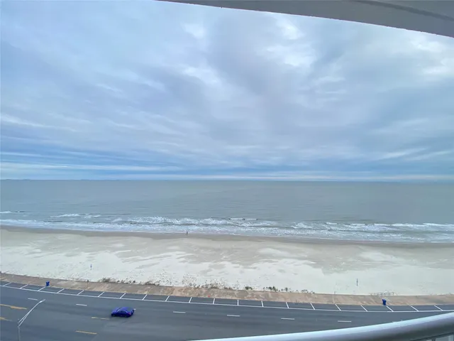 a view of balcony with wooden floor