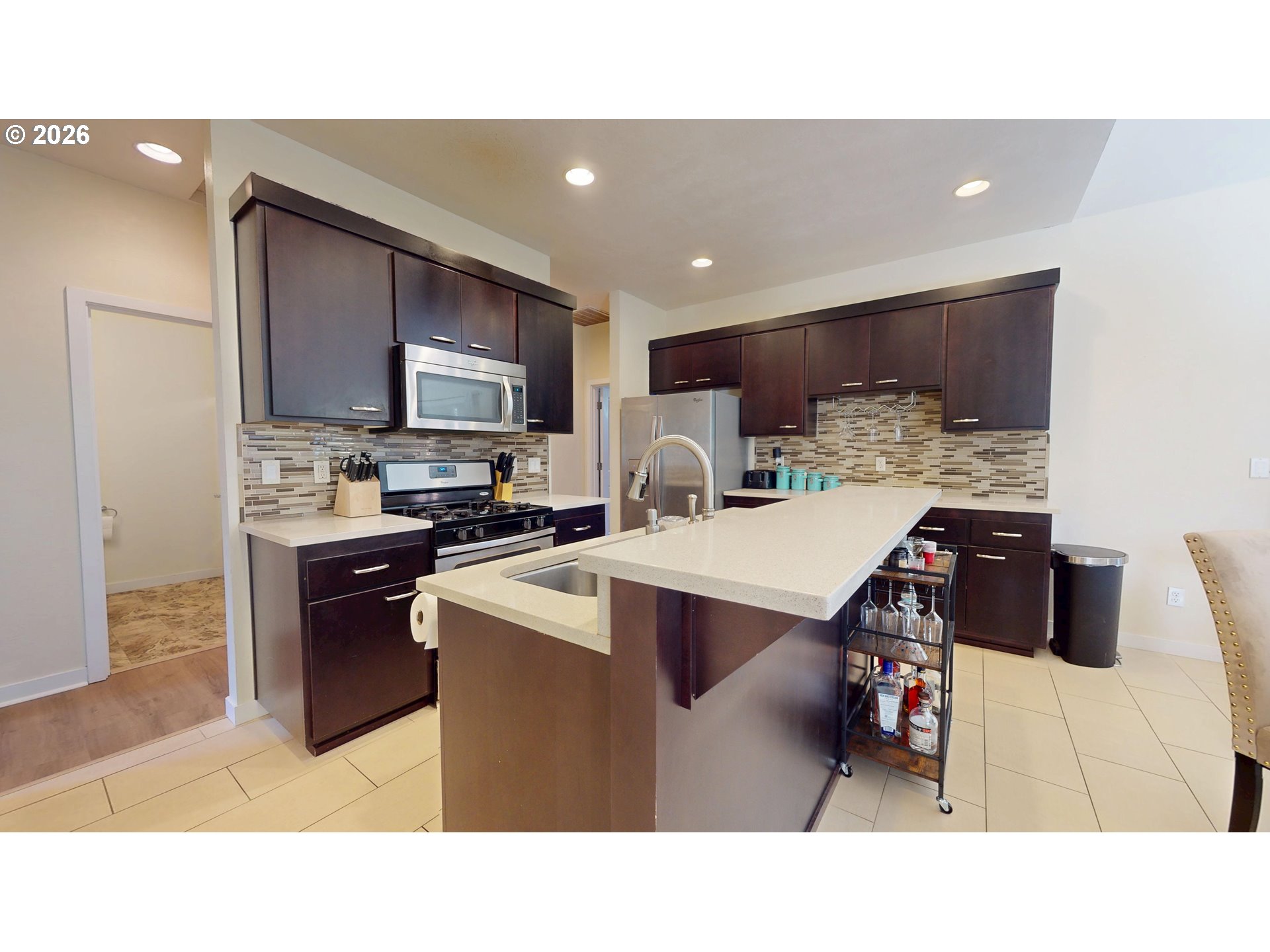 375 Mia Lane Eugene, OR 97401 - Photo 14 of 44 a kitchen with a sink a counter top space stainless steel appliances and cabinets