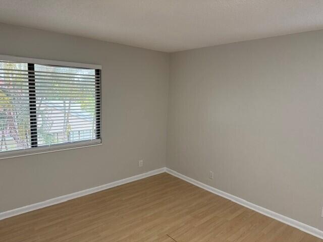 103 Northeast 28th Street Boca Raton, FL 33431 - Photo 30 of 47 wooden floor in an empty room with a window
