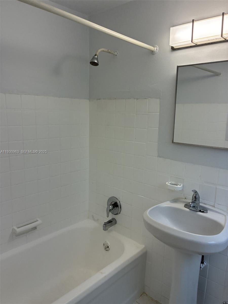 2469 Flamingo Place, Unit 2 Miami Beach, FL 33140 - Photo 16 of 22 a bathroom with a sink and a bathtub