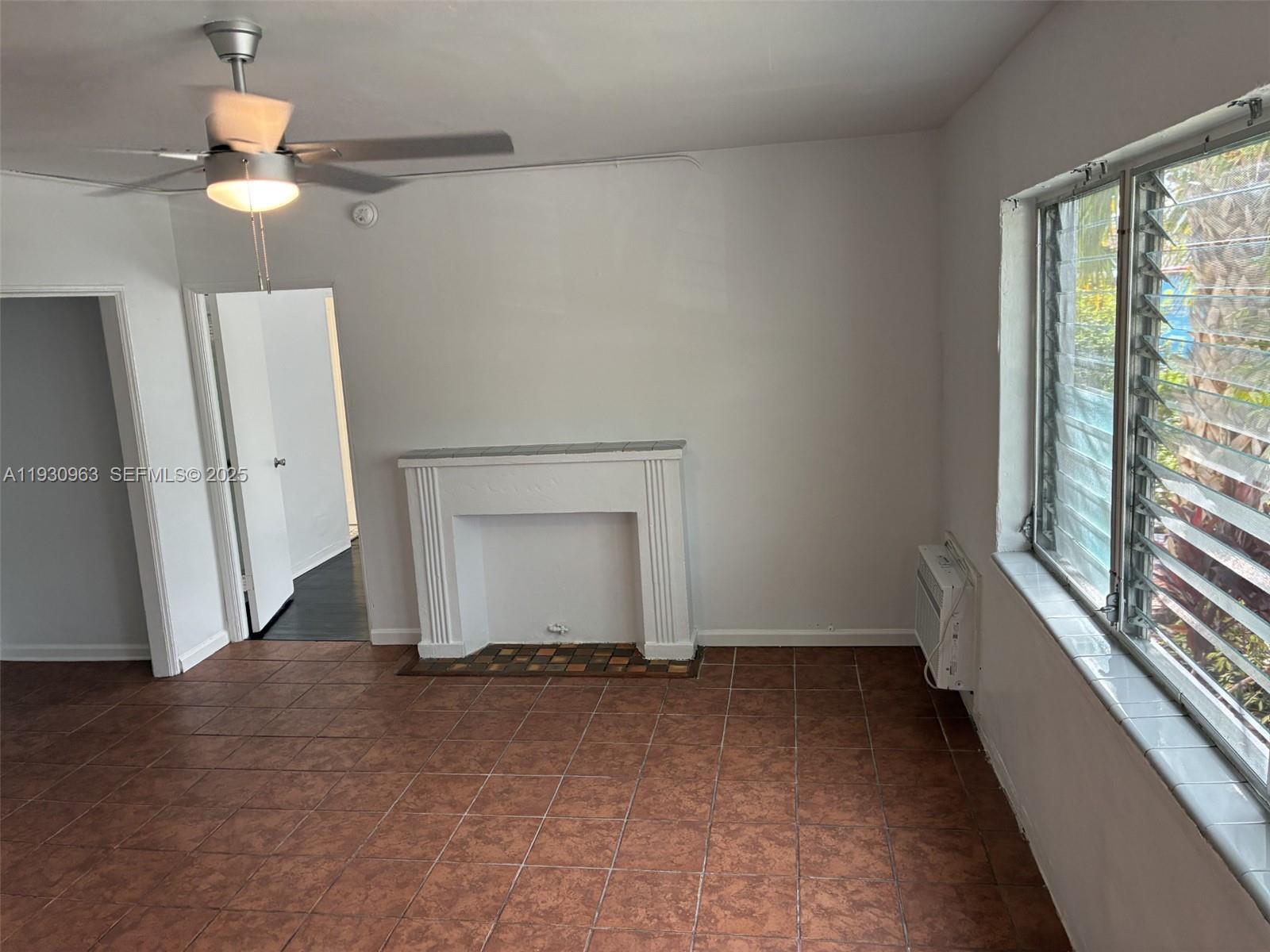 2469 Flamingo Place, Unit 2 Miami Beach, FL 33140 - Photo 7 of 22 a view of a livingroom with a staircase