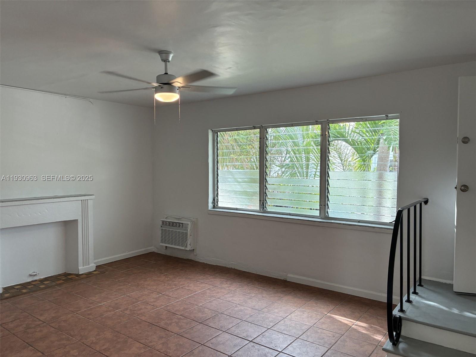 2469 Flamingo Place, Unit 2 Miami Beach, FL 33140 - Photo 8 of 22 a view of a livingroom with a ceiling fan and window