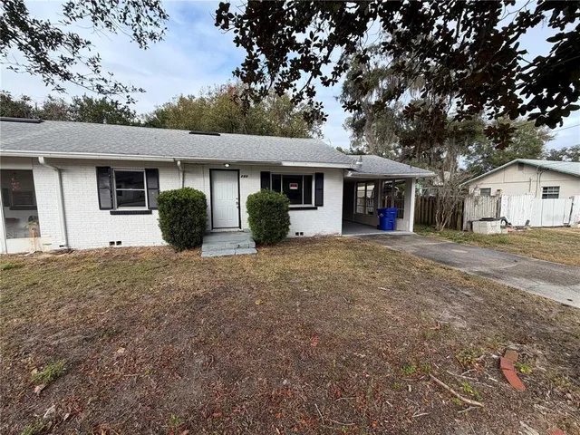 front view of a house with a yard