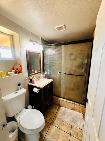 a bathroom with a sink toilet mirror and tub