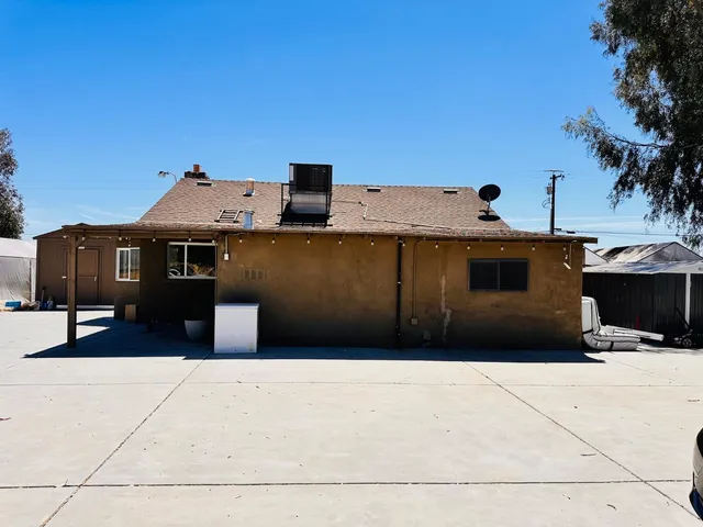 a front view of a house with parking space