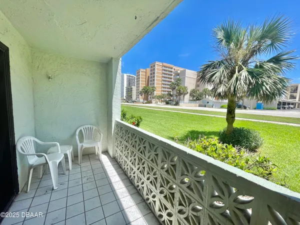 a view of a balcony with lake view and a potted plant