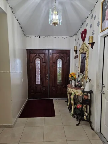 a room with lots of flowers and cabinets