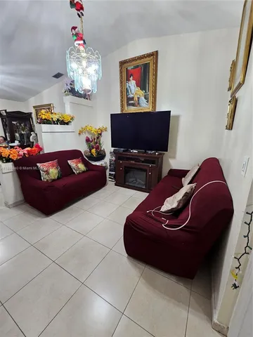 a living room with furniture and a couch