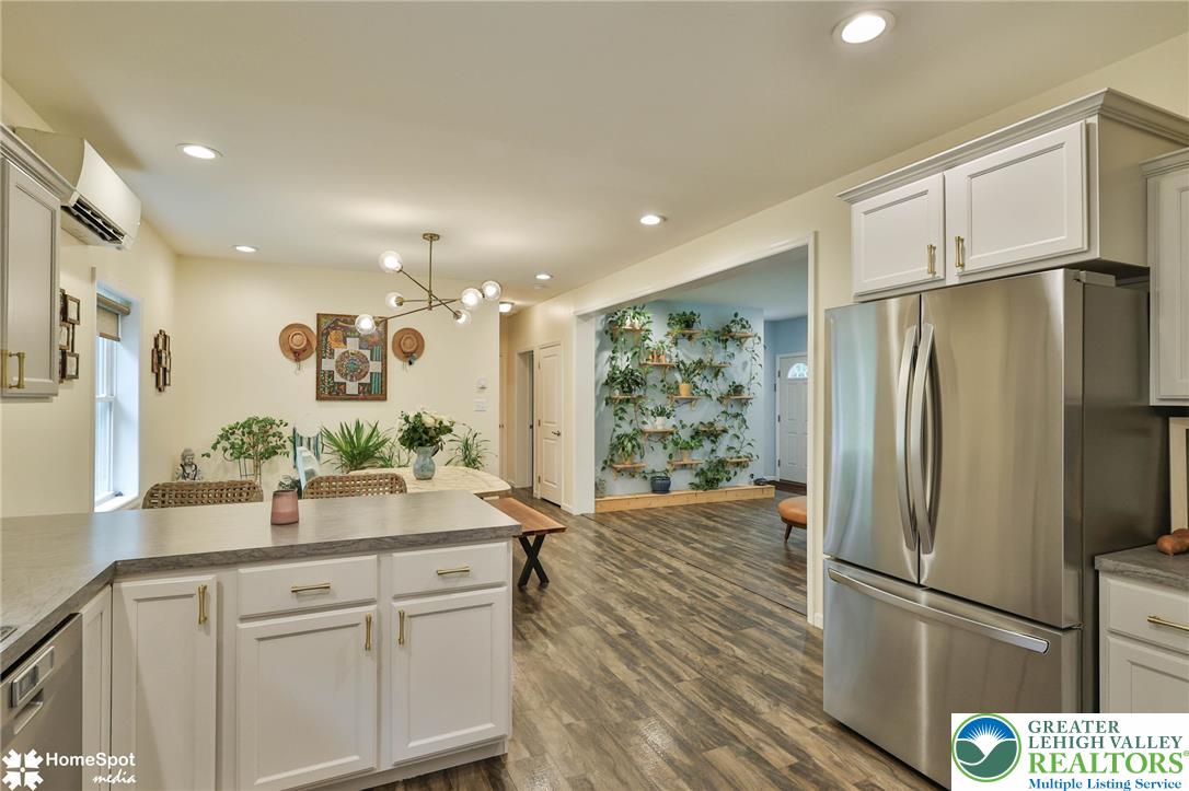318 Church Road Kunkletown, PA 18058 - Photo 23 of 51 A well-appointed kitchen and dining area combine for seamless entertaining, featuring durable flooring and recessed lighting.