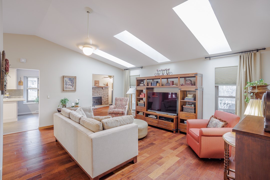 540 Basil Street Springboro, OH 45066 - Photo 6 of 32 This inviting living area features warm wood flooring and ample natural light through multiple skylights.