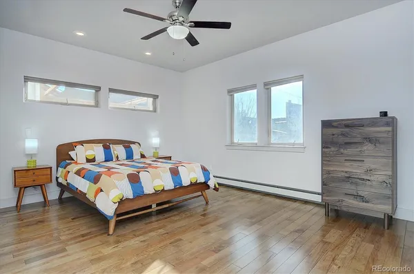a bedroom with a bed and a dresser
