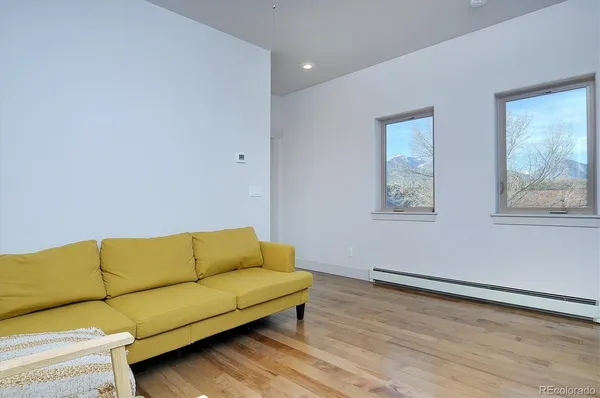 a living room with furniture and a window
