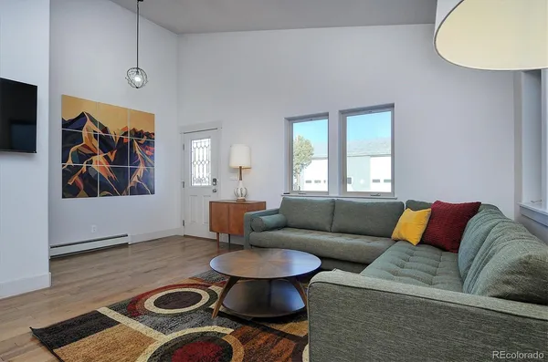 a living room with furniture and a rug