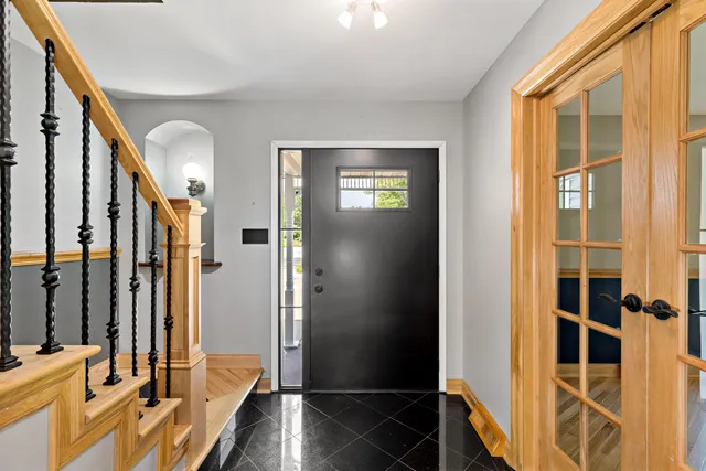 a view of front door with wooden floor