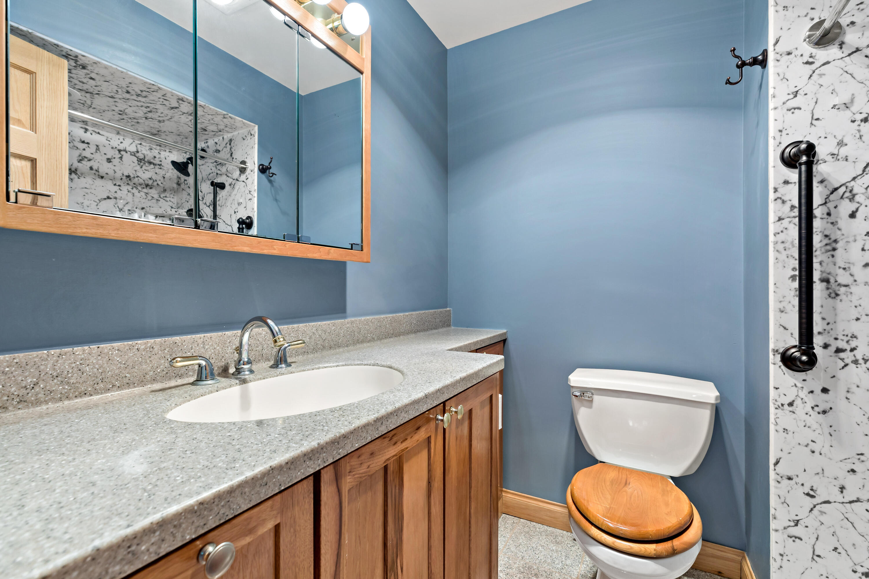 5496 West 107th Court Crown Point, IN 46307 - Photo 20 of 48 a bathroom with a granite countertop toilet sink and mirror