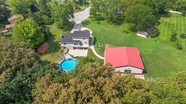 a view of a house with a yard porch and sitting area