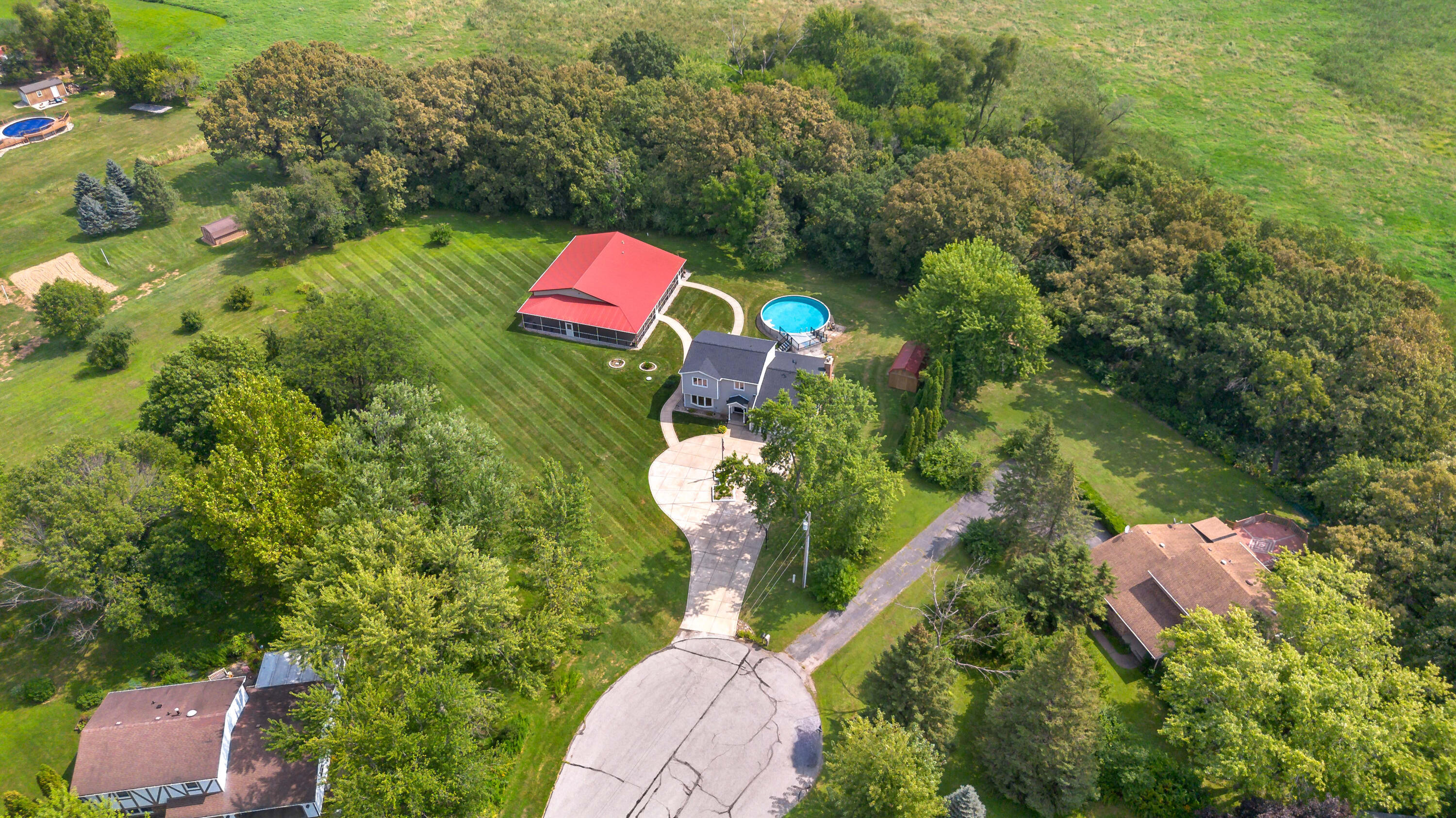 5496 West 107th Court Crown Point, IN 46307 - Photo 47 of 48 an aerial view of a house with a yard and lake view