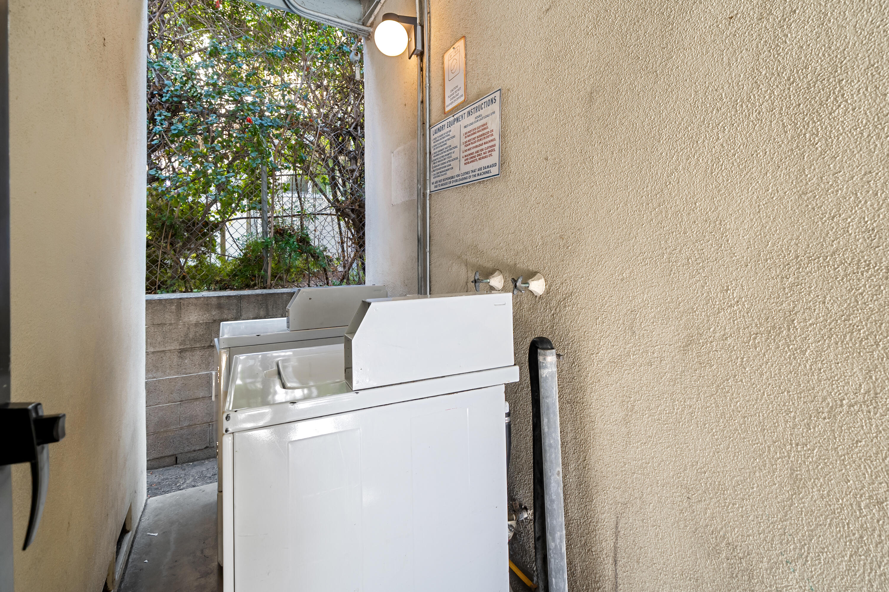 1011 Laguna Street Santa Barbara, CA 93101 - Photo 11 of 14 a kitchen with a refrigerator and a table