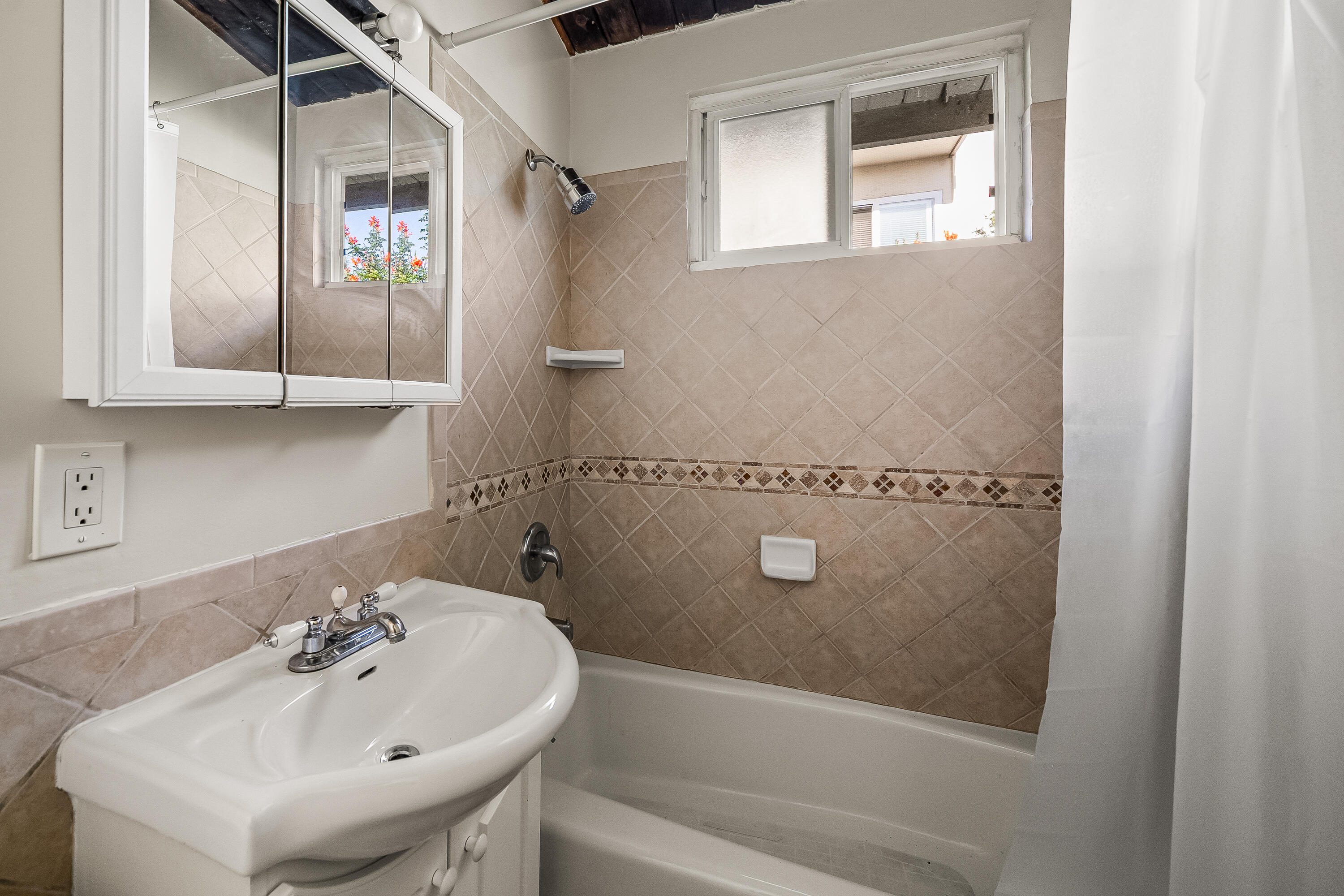 1011 Laguna Street Santa Barbara, CA 93101 - Photo 6 of 14 a bathroom with a sink and a bathtub