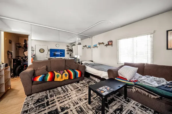a living room with furniture and a window