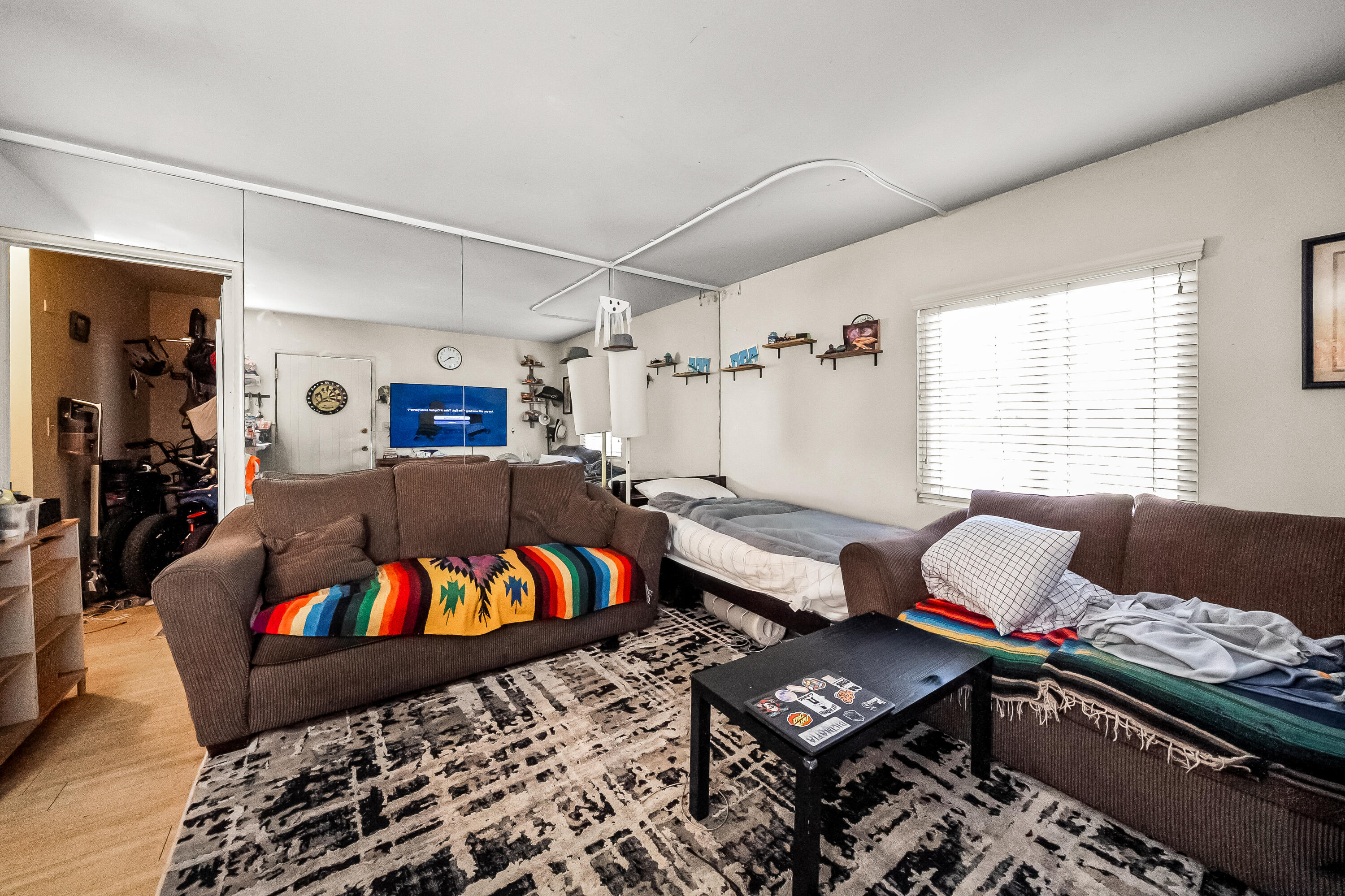 1011 Laguna Street Santa Barbara, CA 93101 - Photo 8 of 14 a living room with furniture and a window