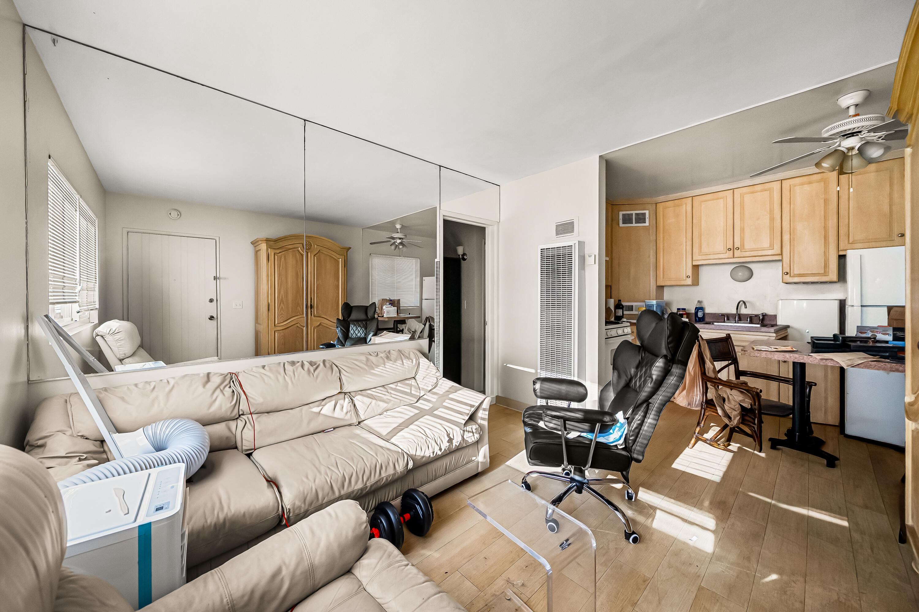 1011 Laguna Street Santa Barbara, CA 93101 - Photo 9 of 14 a living room with furniture a large window and gym equipment