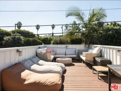a view of a couches in the balcony