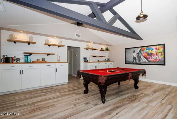 a room with furniture and wooden floor