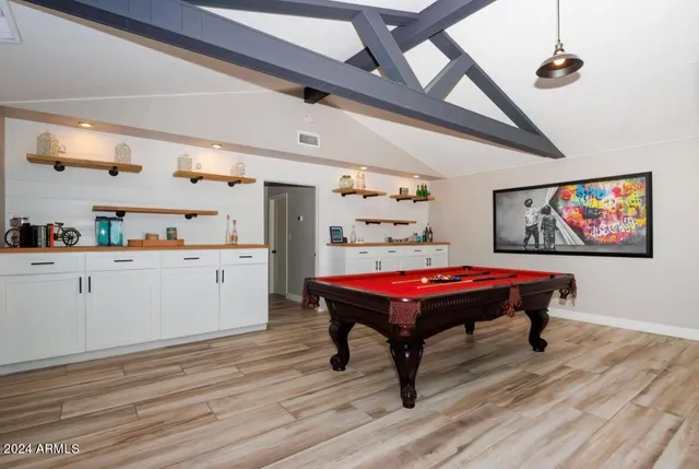 a room with furniture and wooden floor