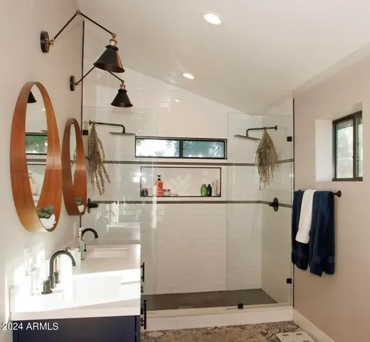 a bathroom with a sink and mirror
