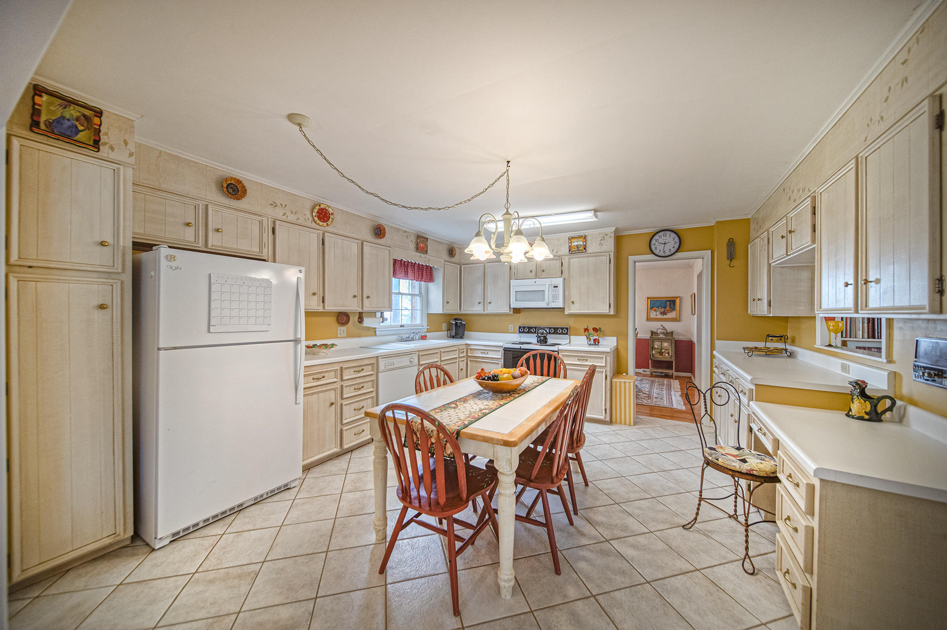 2080 Goodview Town Road, Unit 2082 Goodview, VA 24095 - Photo 17 of 96 a kitchen with granite countertop a refrigerator a stove top oven and a dining table with wooden floor