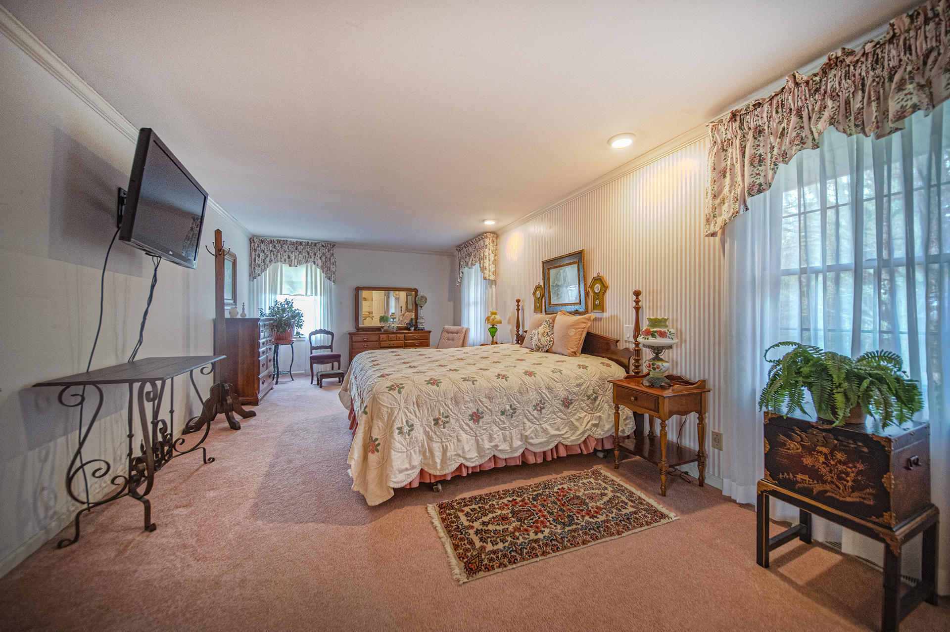 2080 Goodview Town Road, Unit 2082 Goodview, VA 24095 - Photo 25 of 96 a spacious bedroom with a bed a couch and dresser