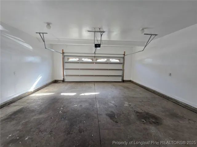 a view of room with stairs and a ceiling fan