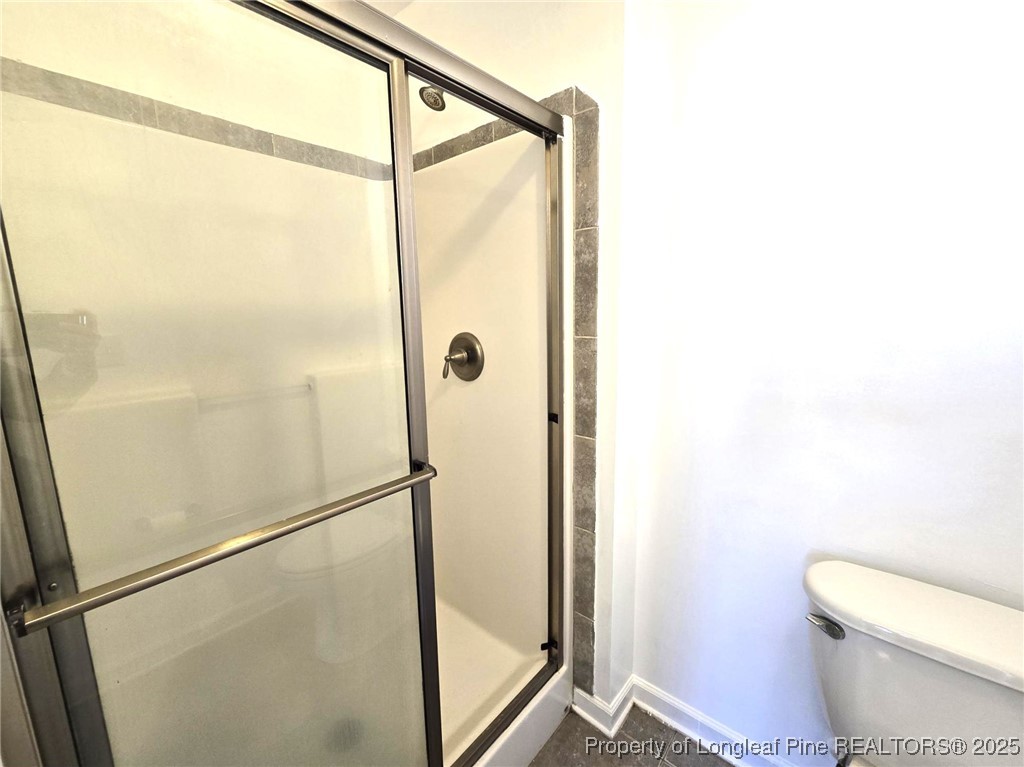 2816 Deepwater Court Fayetteville, NC 28306 - Photo 29 of 34 a bathroom with a shower and a toilet