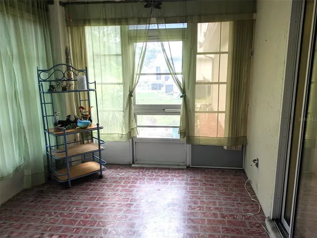 a room with window and furniture