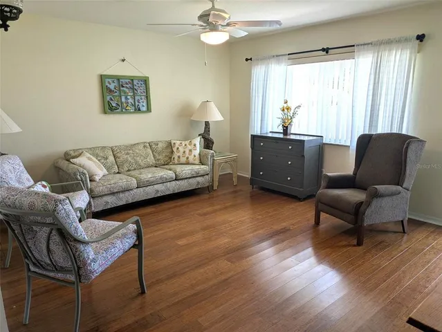 a living room with furniture and a window