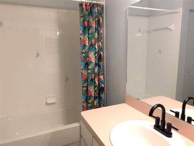 a bathroom with a sink and a bathtub