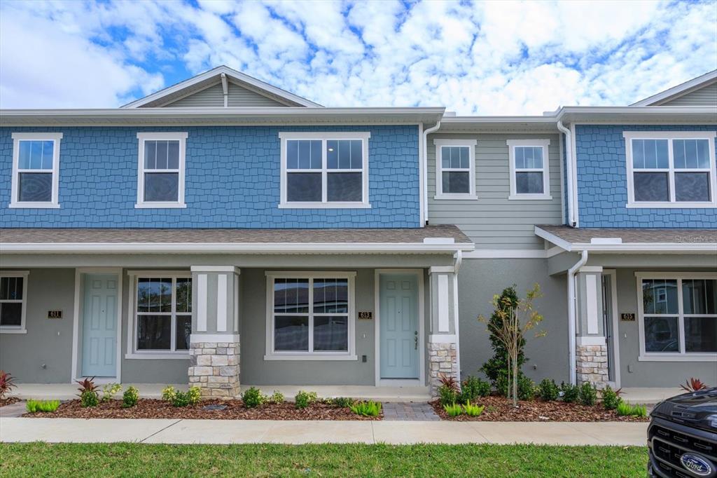 13274 Serene Glade Road Winter Garden, FL 34787 - Photo 1 of 1 a front view of a house with a yard and a garage