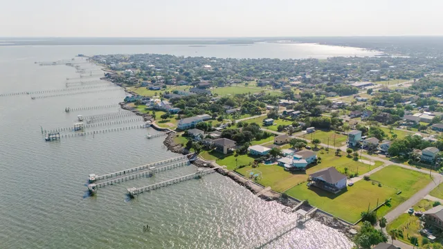 a view of a house with a yard and plants