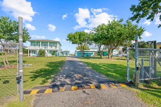 a dining room with furniture a rug and a chandelier