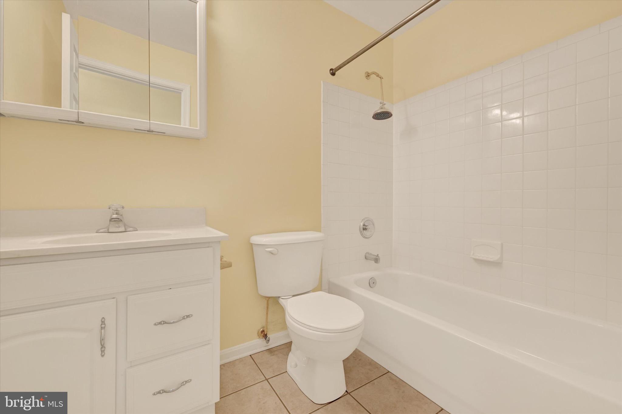 21 Box Circle Baltimore, MD 21221 - Photo 8 of 23 a bathroom with a sink a toilet and shower