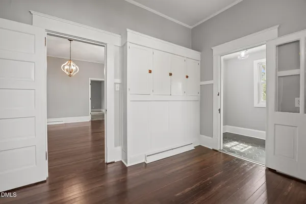 a bathroom with a granite countertop sink toilet mirror and bathtub