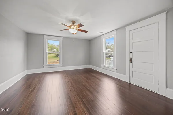 a bathroom with a shower a sink and a mirror