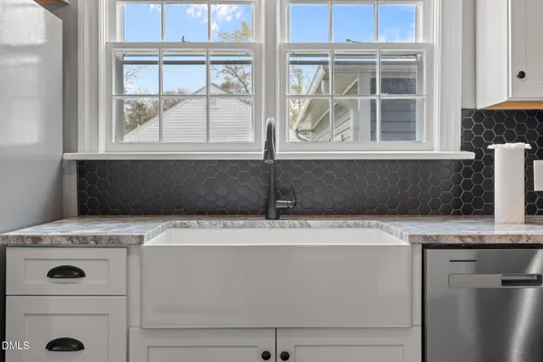a view of balcony with wooden floor and large trees