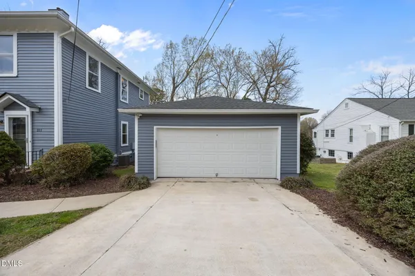 a view of a yard with a tree