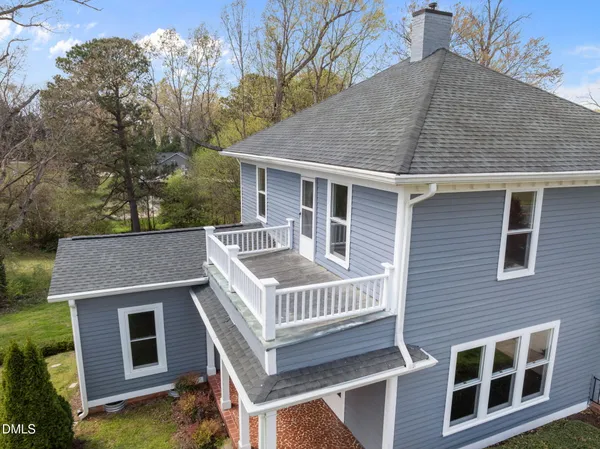 an aerial view of a house with swimming pool