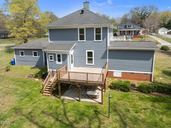 a view of a house with a yard porch and sitting area