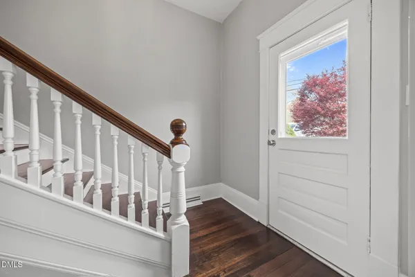 a view of entryway with wooden floor