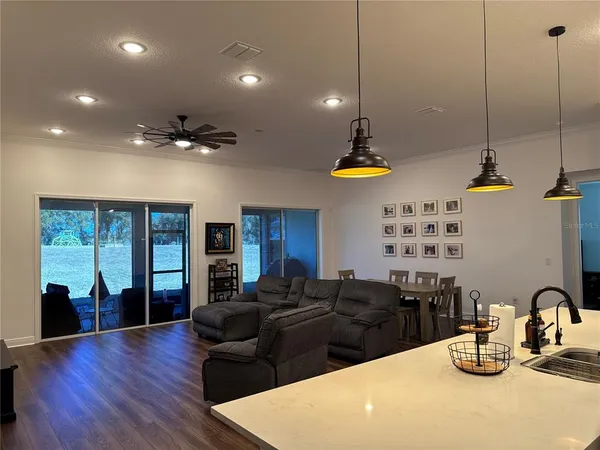 a bedroom with two beds and a flat screen tv