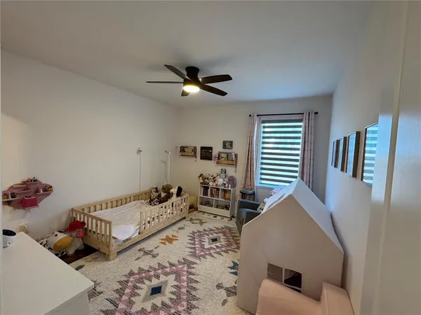 a view of walk in closet with clothes
